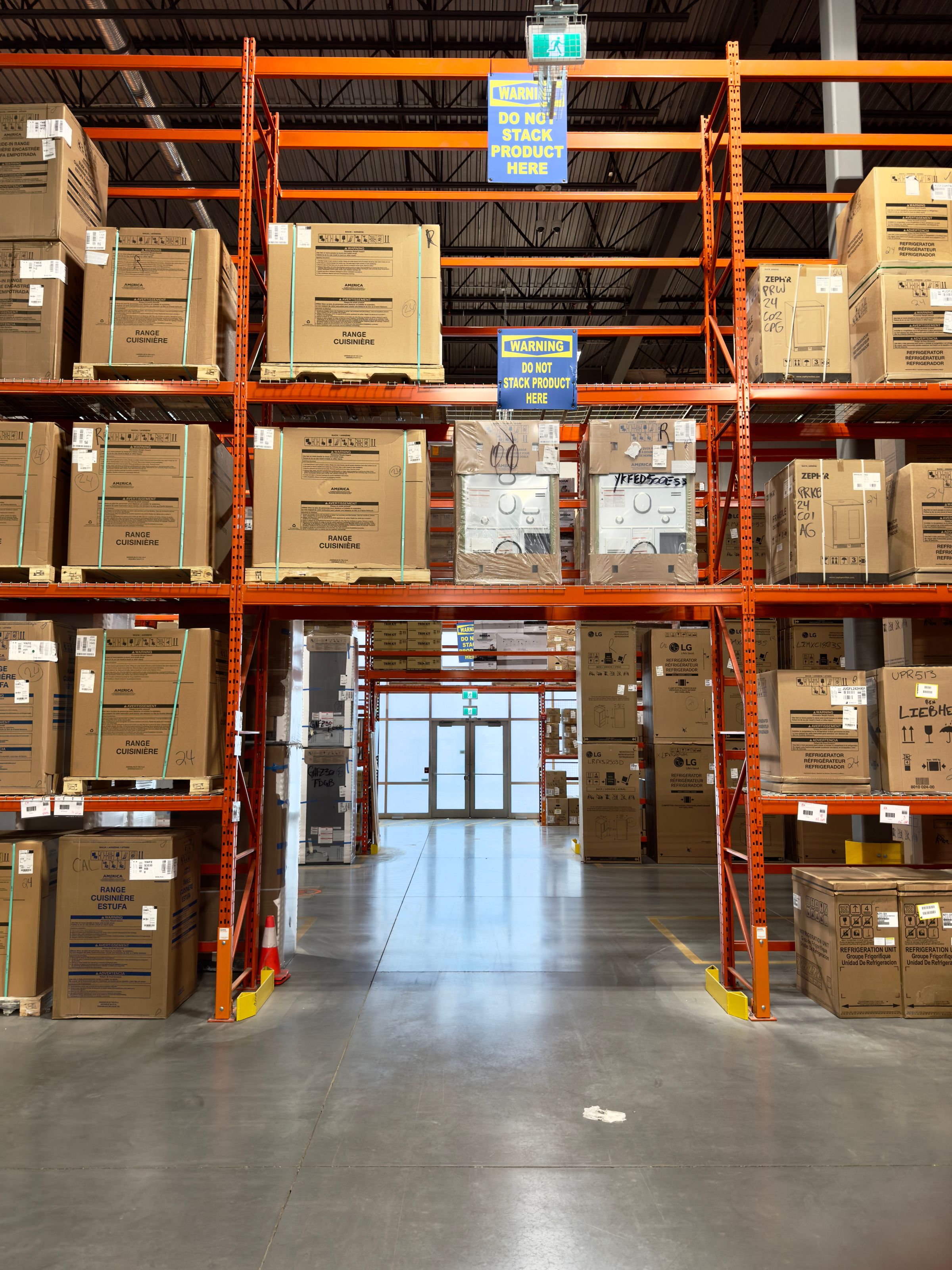 Palletized cartons stored on industrial warehouse racking